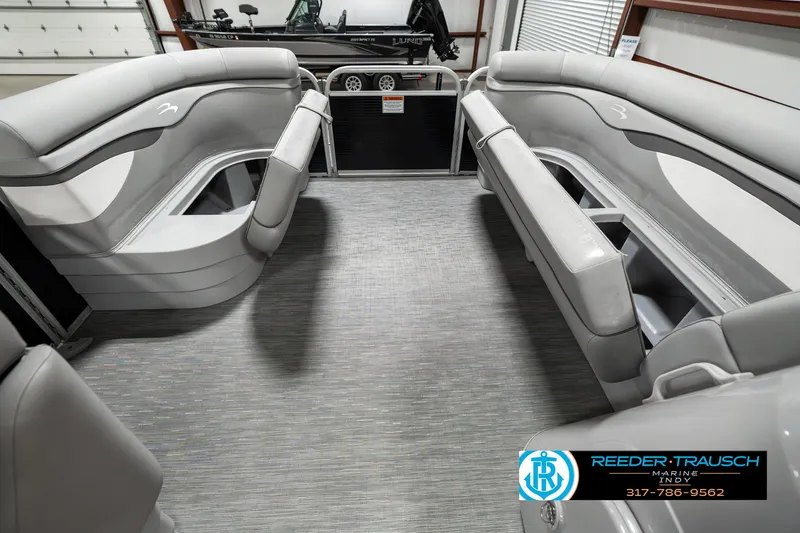 Slide: The Image of 2023 Bennington 20 SVL pontoon boat interior with gray seating and flooring. - 19