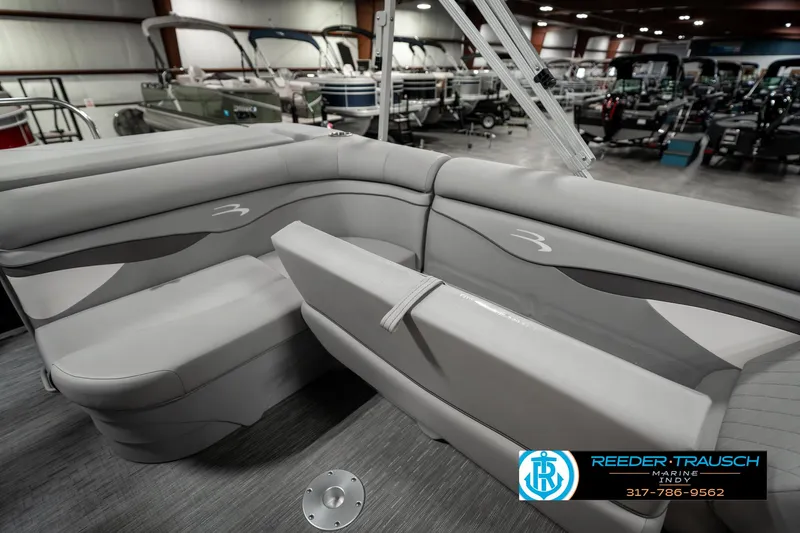 Slide: The Image of 2023 Bennington 20 SVL pontoon boat interior with gray seating in showroom. - 22