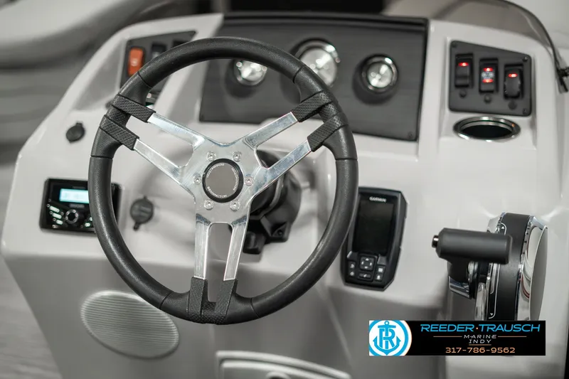 Slide: The Image of 2023 Bennington 20 SVL boat dashboard with steering wheel and controls. - 25