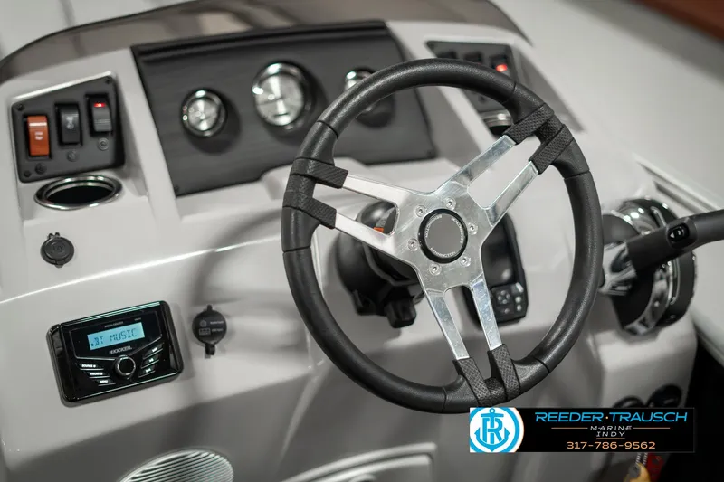 Slide: The Image of 2023 Bennington 20 SVL boat dashboard with steering wheel and control panel. - 26