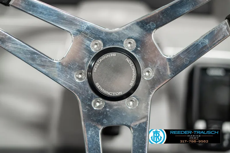 Slide: The Image of 2023 Bennington 20 SVL steering wheel, metallic finish, Reeder-Trausch Marine logo visible. - 27