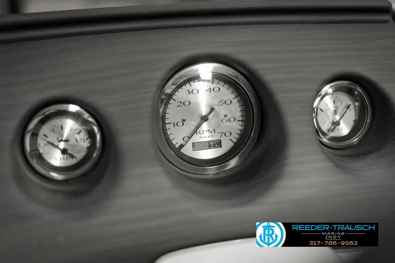 Slide: The Image of Dashboard gauges of 2023 Bennington 20 SVL boat, featuring RPM and fuel indicators. - 30