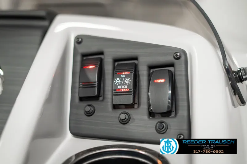 Slide: The Image of Control panel of 2023 Bennington 20 SVL boat with switches and logo. - 32