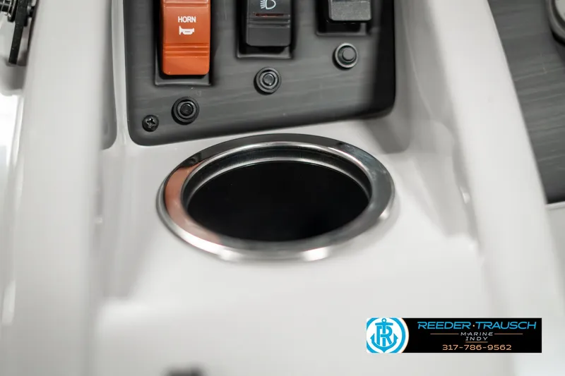 Slide: The Image of 2023 Bennington 20 SVL boat console with cup holder and control switches. - 39