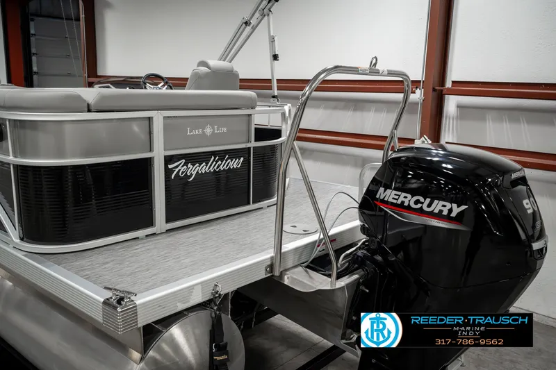 Slide: The Image of 2023 Bennington 20 SVL pontoon boat with Mercury engine in showroom. - 48