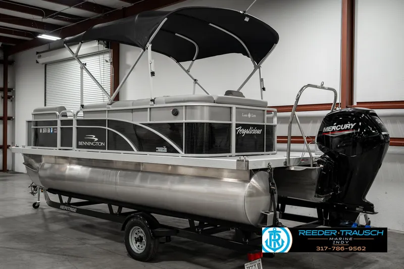 Slide: The Image of 2023 Bennington 20 SVL pontoon boat with Mercury engine in showroom. - 6