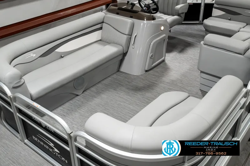 Slide: The Image of 2023 Bennington 20 SVL pontoon boat interior with gray seating and helm. - 9