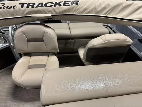 Slide: The Image of 2023 Sun Tracker SportFish 22 XP3 boat interior with beige seating. - 13