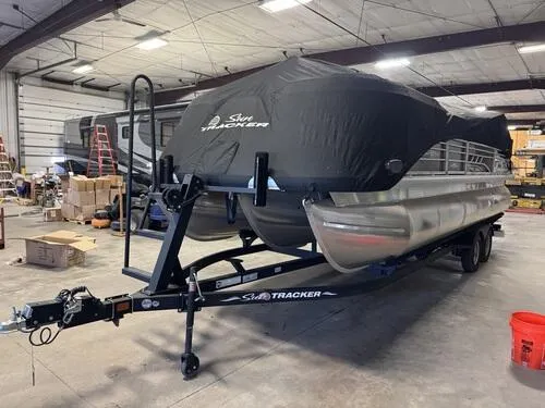 Slide: The Image of 2023 Sun Tracker SportFish 22 XP3 pontoon boat in storage facility. - 15
