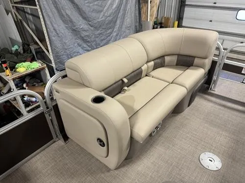 Slide: The Image of 2023 Sun Tracker SportFish 22 XP3 boat interior with beige seating and cup holder. - 8