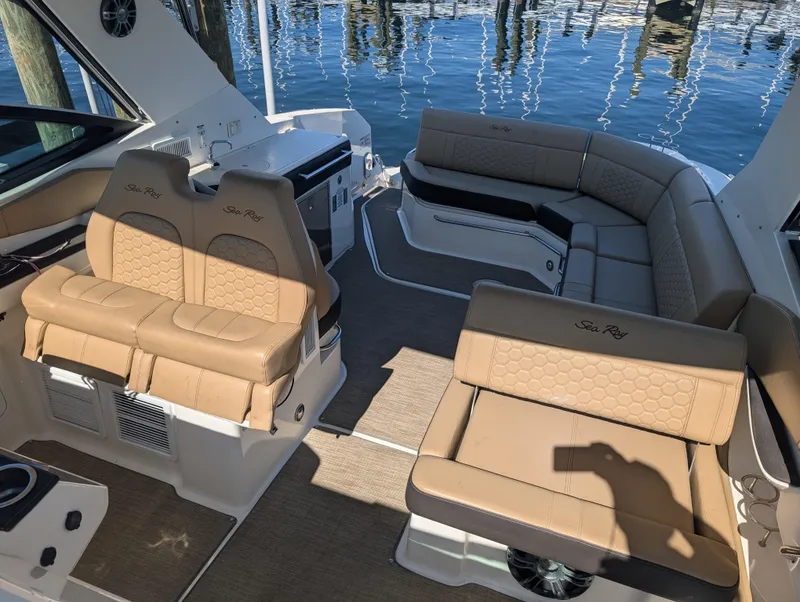 Slide: The Image of 2019 Sea Ray Sundancer 320 interior with tan seating and water view. - 15