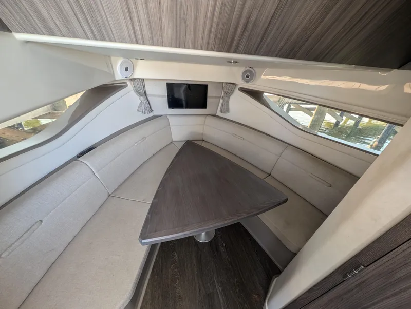 Slide: The Image of 2019 Sea Ray Sundancer 320 cabin interior with sleek seating and modern design. - 19