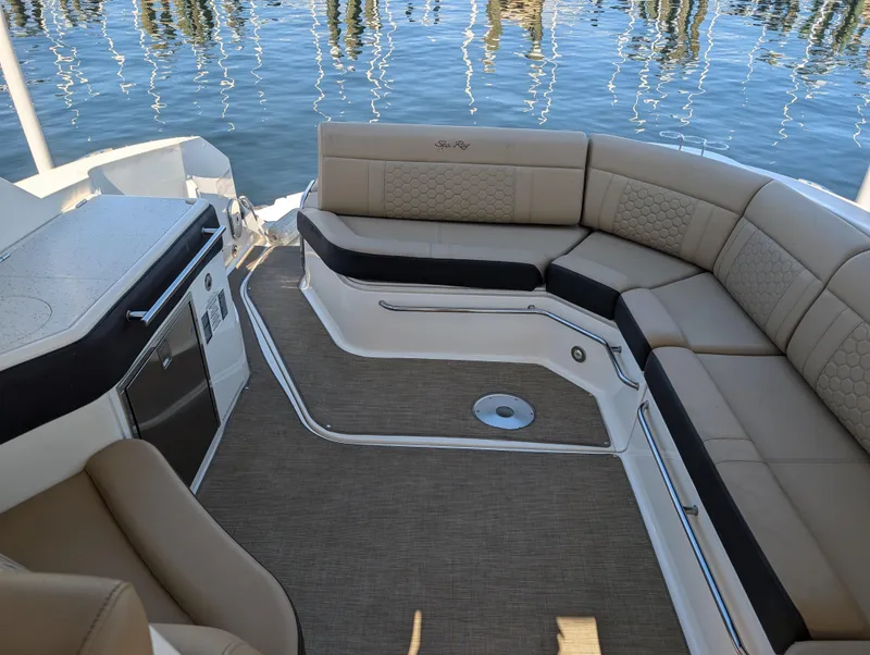 Slide: The Image of 2019 Sea Ray Sundancer 320 interior with beige seating and water view. - 6