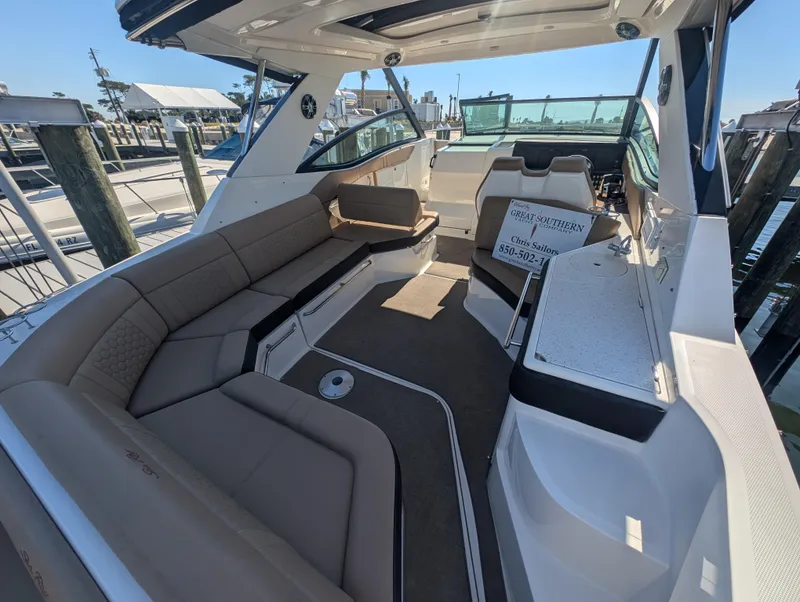 Slide: The Image of 2019 Sea Ray Sundancer 320 interior with spacious seating and modern design. - 9