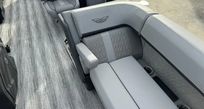 Slide: The Image of 2025 Bennington 22MFB Quad Bench with luxurious gray seating and elegant design. - 15