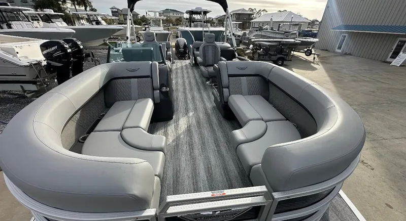 Slide: The Image of 2025 Bennington 22MFB Quad Bench pontoon boat with spacious seating and modern design. - 4