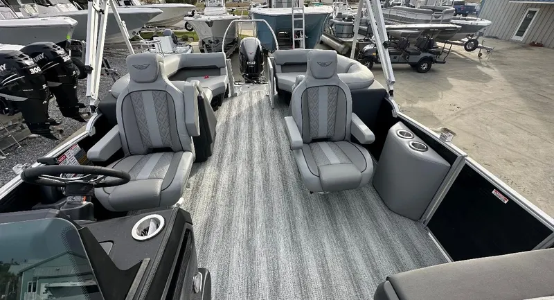 Slide: The Image of 2025 Bennington 22MFB Quad Bench boat interior with gray seating and striped flooring. - 6