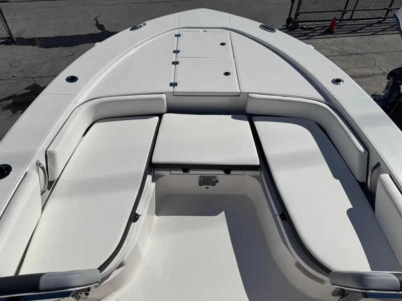 Slide: The Image of 2024 Robalo 246 Cayman boat with spacious white seating area. - 10