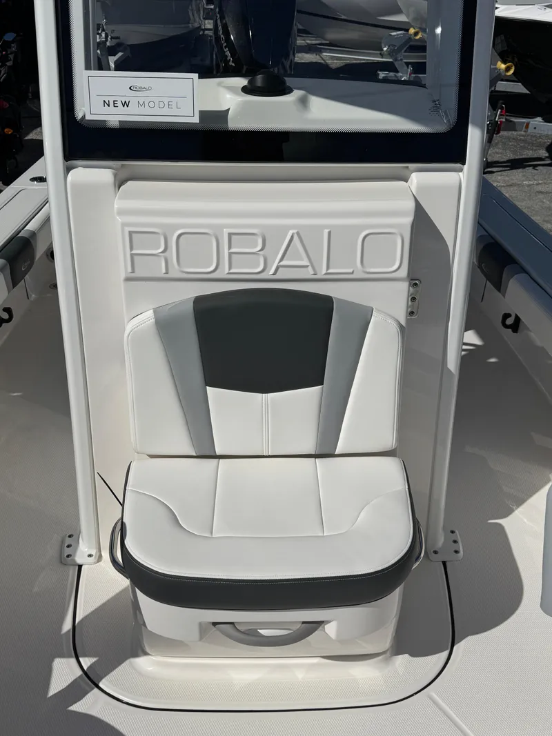 Slide: The Image of 2024 Robalo 246 Cayman boat seat with logo, white and black design. - 16