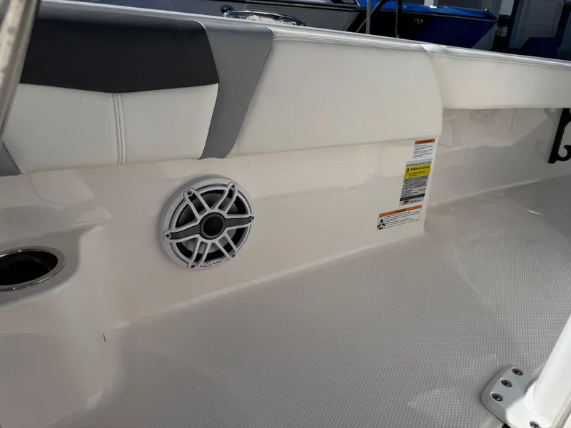 Slide: The Image of 2024 Robalo 246 Cayman boat interior with speaker and seating detail. - 19
