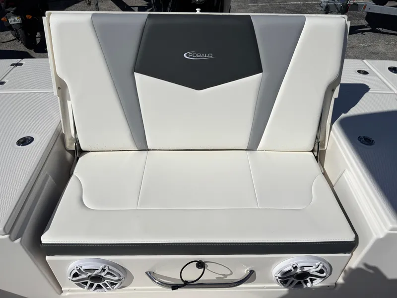 Slide: The Image of 2024 Robalo 246 Cayman boat seat with speakers and stylish design. - 26