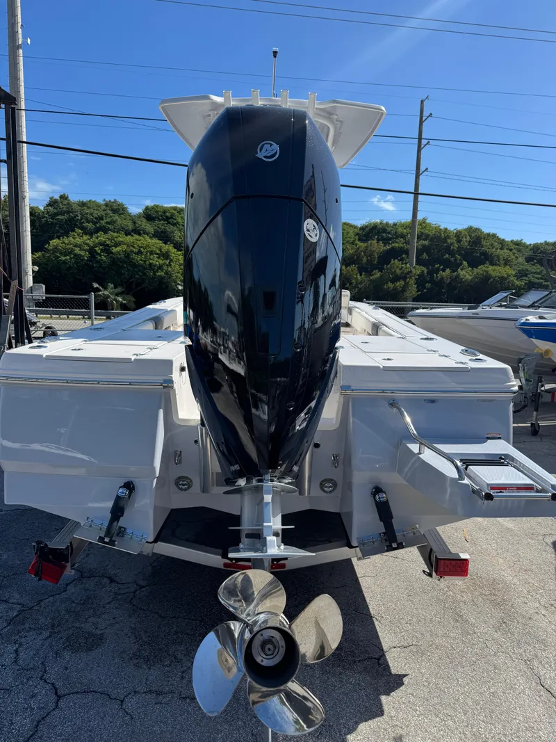Slide: The Image of 2024 Robalo 246 Cayman boat with powerful outboard motor, rear view. - 4