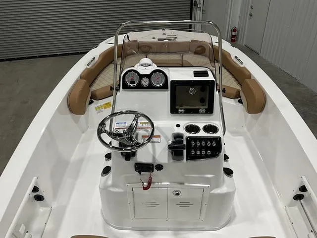 Slide: The Image of 2025 NauticStar 191 Hybrid boat interior with steering console and seating. - 12