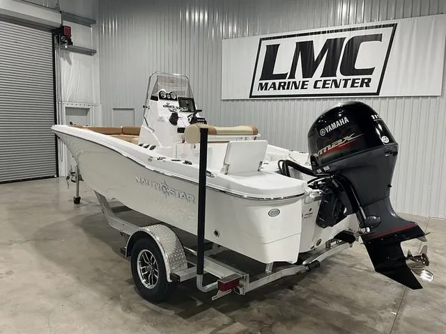 Slide: The Image of 2025 NauticStar 191 Hybrid boat on trailer at LMC Marine Center. - 3