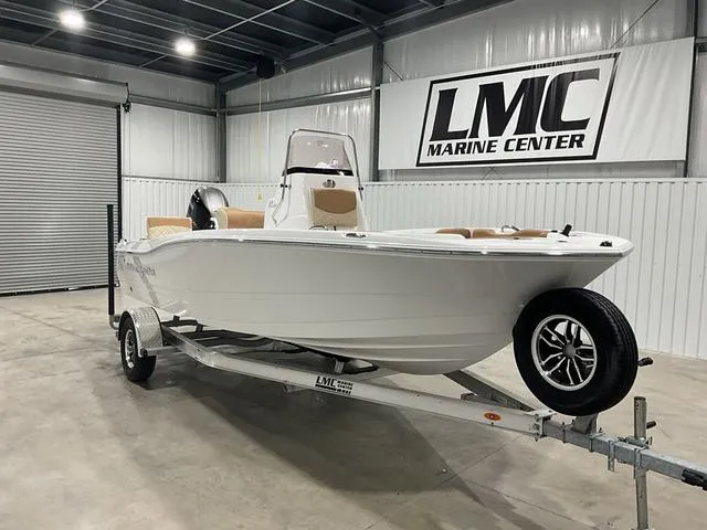 Slide: The Image of 2025 NauticStar 191 Hybrid boat on trailer at LMC Marine Center showroom. - 5