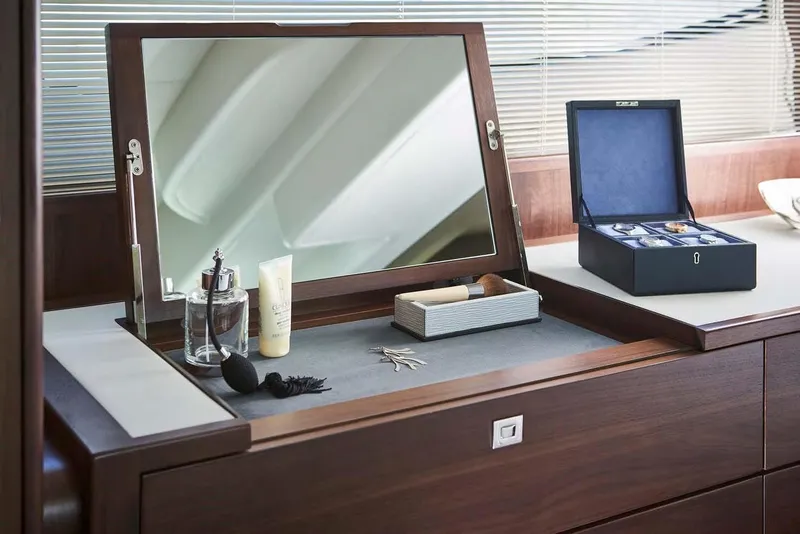 Slide: The Image of Luxurious vanity setup on 2025 Princess 50 Flybridge yacht with mirror and accessories. - 11