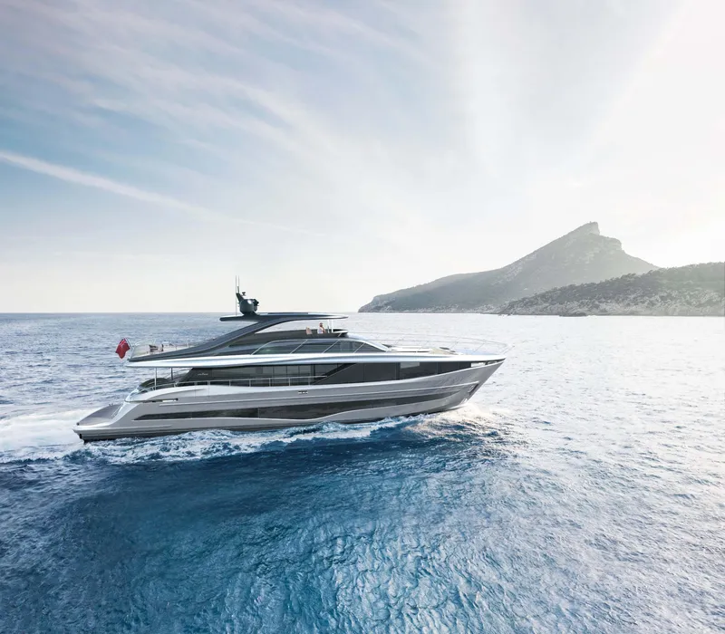Slide: The Image of 2025 Princess Y95 Motor Yacht cruising on open sea near mountainous coastline. - 2