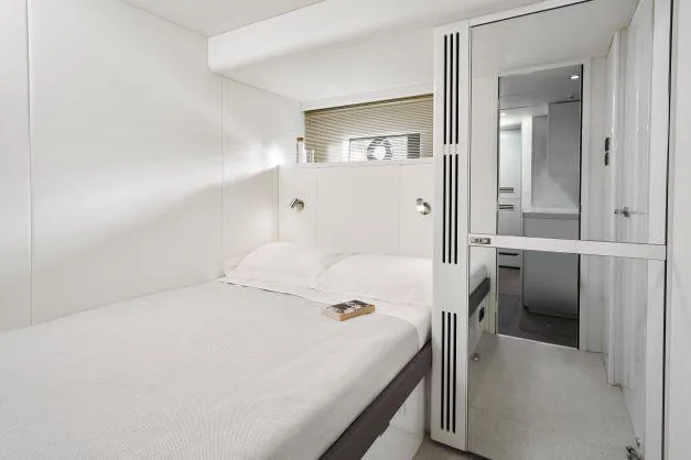 Slide: The Image of Luxurious bedroom interior of 2025 Princess Y95 Motor Yacht, featuring modern design and cozy ambiance. - 21