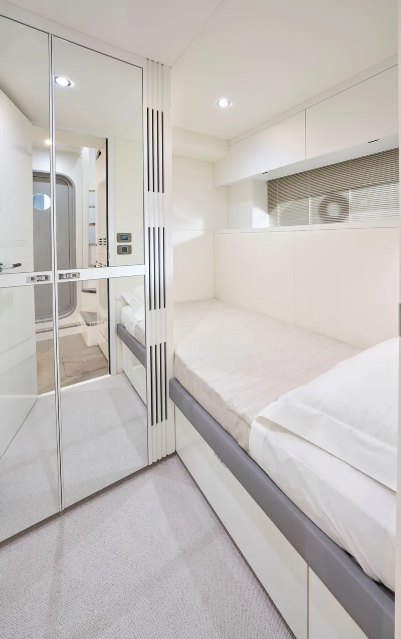 Slide: The Image of Luxurious interior of 2025 Princess Y95 Motor Yacht cabin, featuring modern design and elegant finishes. - 24