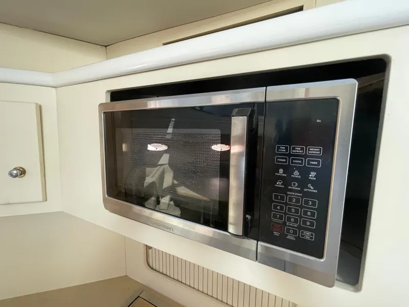Slide: The Image of Built-in microwave in a 1997 Carver 405 yacht kitchen. - 22