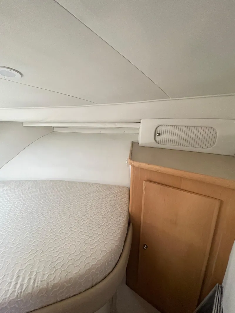 Slide: The Image of Interior cabin of a 1997 Carver 405 yacht with bed and wooden cabinet. - 23