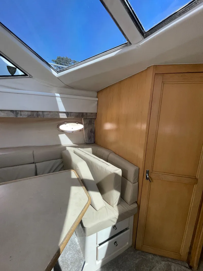 Slide: The Image of Interior of a 1997 Carver 405 yacht with skylight and seating area. - 28