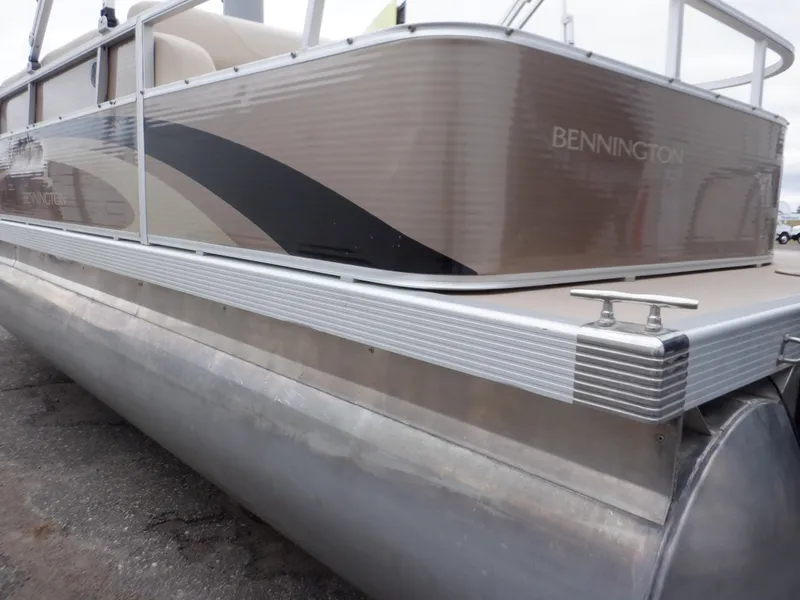 Slide: The Image of 2011 Bennington 22 SSL pontoon boat with sleek aluminum exterior design. - 13