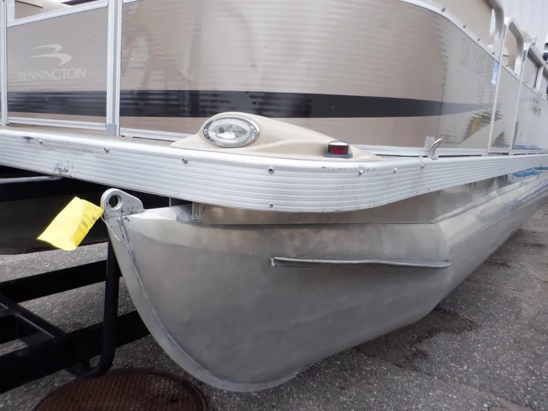 Slide: The Image of 2011 Bennington 22 SSL pontoon boat on trailer, close-up view. - 19