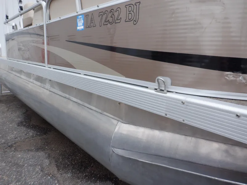 Slide: The Image of 2011 Bennington 22 SSL pontoon boat side view with registration number IA 7232 BJ. - 23