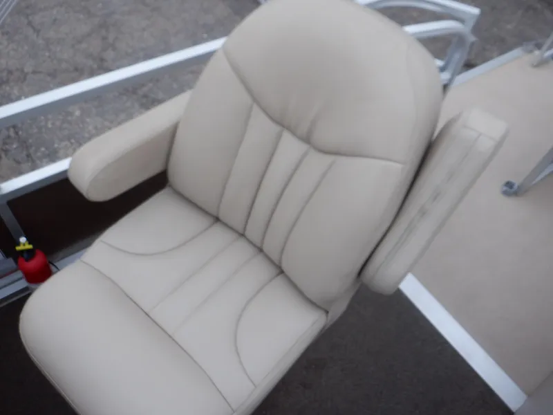 Slide: The Image of Beige captain's chair on 2011 Bennington 22 SSL boat, featuring armrests and cushioned design. - 35
