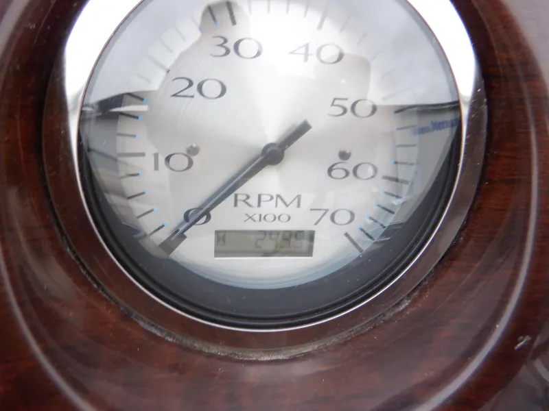 Slide: The Image of Close-up of a 2011 Bennington 22 SSL RPM gauge displaying 2400 RPM. - 37