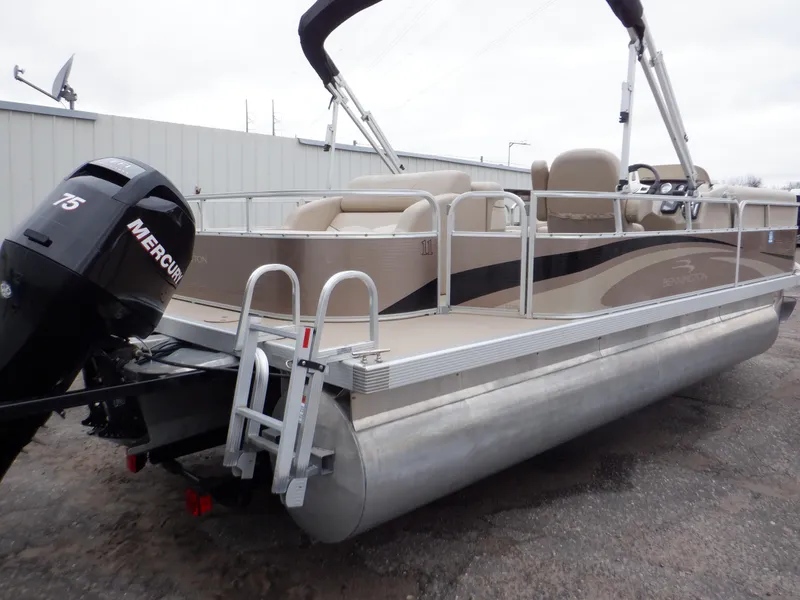 Slide: The Image of 2011 Bennington 22 SSL pontoon boat with Mercury 75 engine, docked outdoors. - 4