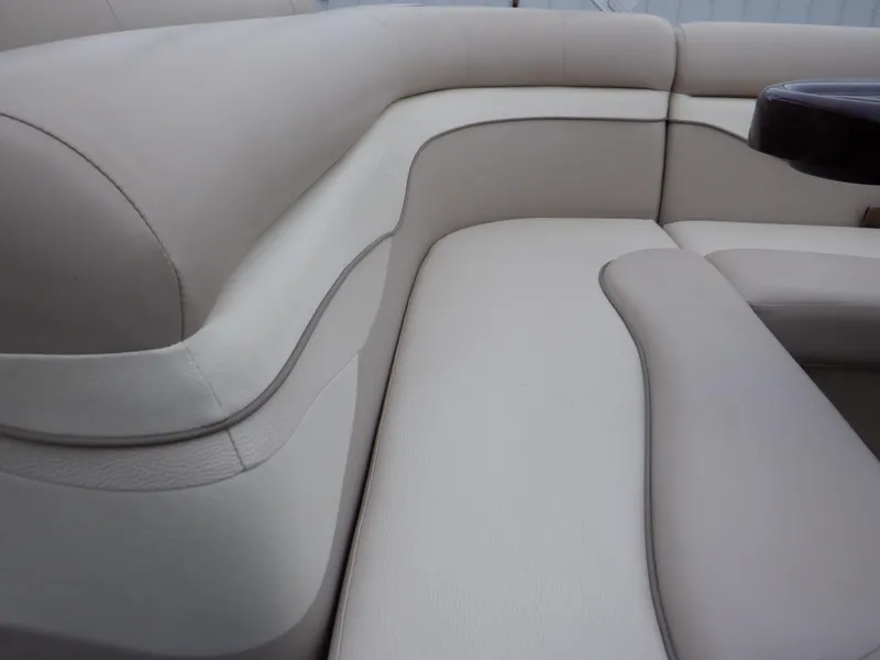 Slide: The Image of 2011 Bennington 22 SSL boat interior with beige seating and sleek design. - 41