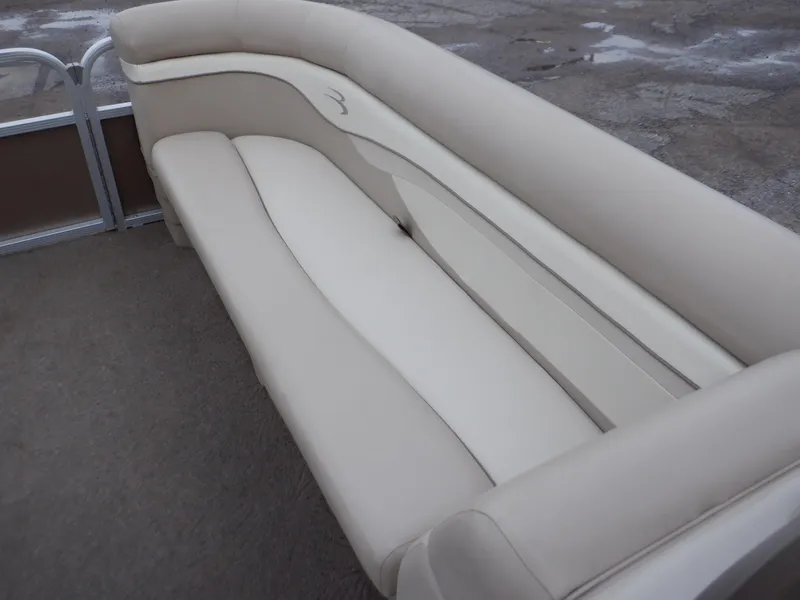 Slide: The Image of 2011 Bennington 22 SSL boat interior with beige seating and carpeted floor. - 43