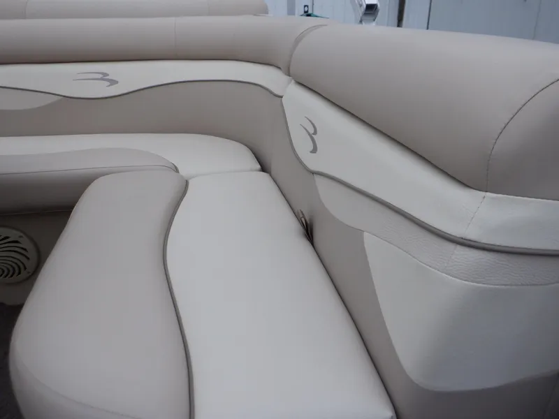 Slide: The Image of 2011 Bennington 22 SSL boat interior with beige leather seating. - 46