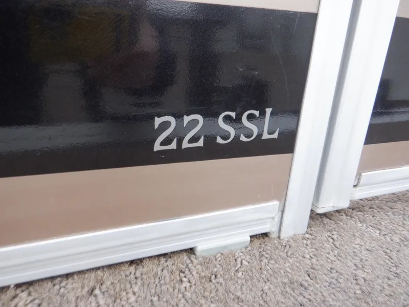 Slide: The Image of 2011 Bennington 22 SSL boat model nameplate on exterior panel. - 9