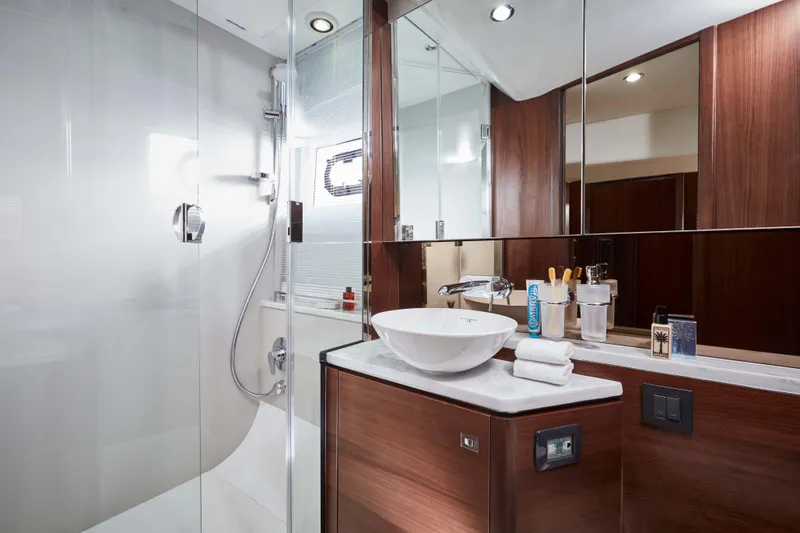 Slide: The Image of Luxurious bathroom in 2025 Princess V50 Open yacht with modern fixtures and wooden accents. - 14