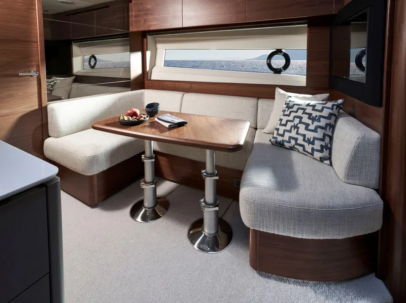 Slide: The Image of Luxurious interior of 2025 Princess V50 Open yacht with elegant seating and table. - 21