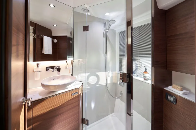 Slide: The Image of Luxurious bathroom in 2025 Princess V50 Open yacht with modern fixtures and glass shower. - 23