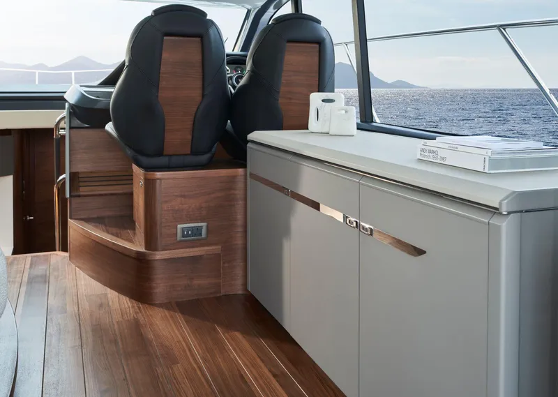 Slide: The Image of Interior of 2025 Princess V50 Open yacht with sleek wood and modern design. - 27